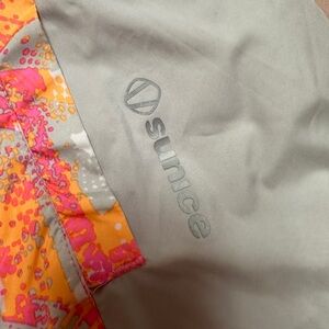 Sunice golf vest reversible pink orange medium